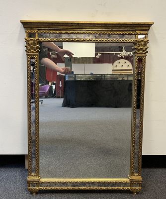a mirror that is sitting on the floor in a room