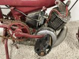 a close up of a motorcycle with a chain attached to it
