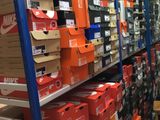 boxes and boxes are stacked on a shelf in a store