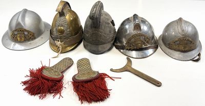 a lot of different types of helmets on the table