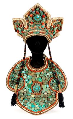 a close up of a mannequin wearing a hat and dress