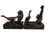 pair of bronze ducks on marble bases
