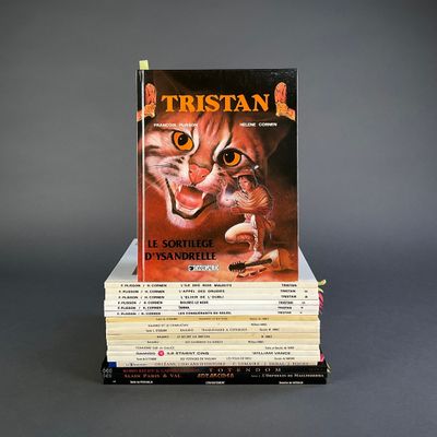 many books stacked on top of each other on a table