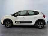 a white citrole is parked in a white room