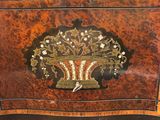 an image of a small chest with a decorative decoration on the front