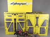 a yellow box with a motorcycle and other toys on it