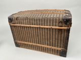 an old trunk that is sitting on a white surface