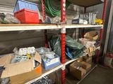 many boxes of tools on the shelves in the garage