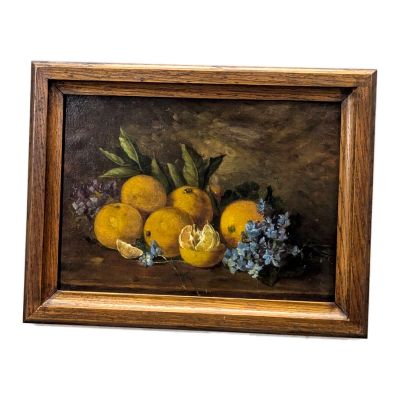 tableau représentant une nature morte composée d'oranges et de bouches d'incendie bleues, dans un cadre en bois