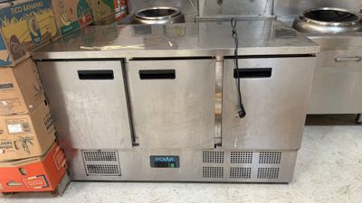 a stainless steel counter top with two ovens on it