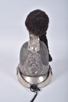 a silver helmet with a fur ball on it