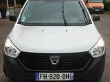 a white van that is parked in a parking lot
