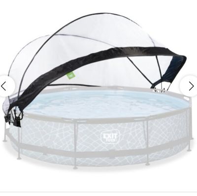 an above ground swimming pool with a net over it