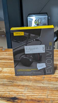 a box of headphones sitting on a wooden table