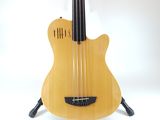 a guitar that is sitting on a stand on a white background