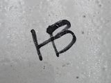 a black and white photo of the word h on a dirty surface