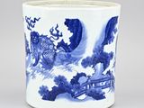 a blue and white vase with a dragon on it