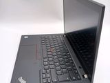 a laptop with a black keyboard sitting on a white surface