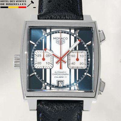 a close up of a watch with a black strap