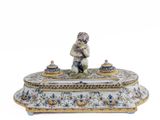 a small figurine sitting on top of a box