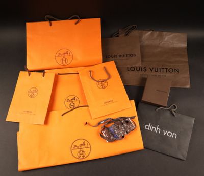 louis vuitton bags and a pair of sunglasses sitting on a table