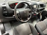 a dashboard of a car with a steering wheel and dashboard controls
