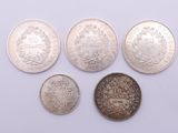 a group of five different british coins