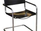an image of a black leather and chrome chair on a white background