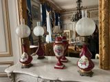 three lamps that are sitting on a marble table