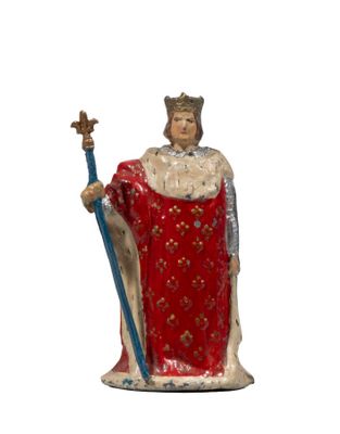 figurine of a statue of a king with a crown and a sword