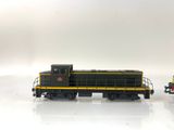 two toy trains sitting side by side on a white surface
