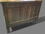 a bed with a wooden headboard and a wooden foot board