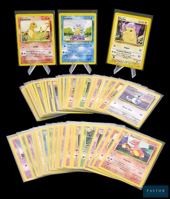 Plusieurs cartes Pokémon sont représentées sur un fond noir.