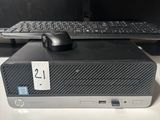 a computer sitting on a desk with a keyboard and mouse
