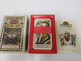 two playing cards are in a red box on a white table