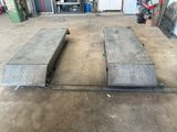 two concrete benches in the middle of a garage