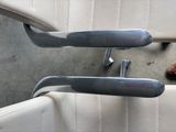 a close up of a car door handle with a screw in it
