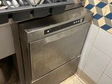 a silver dishwasher and a black dishwasher in a kitchen