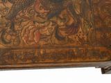 a wooden table with a dragon design on it