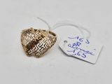 a close up of a gold ring with a tag on it