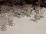 a lot of empty wine glasses sitting on a table