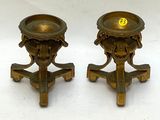 pair of antique brass candlesticks with lion heads on stands