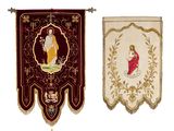 two banners with a picture of jesus and a woman hanging on a wall