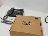 a box that has a phone in it on a table