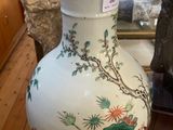 a vase that is sitting on a table in a room