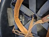 a close up of a helmet with a leather strap
