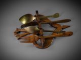 a lot of spoons, forks and spoons on a table