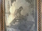 painting of a man sitting on a rug with a child in his lap