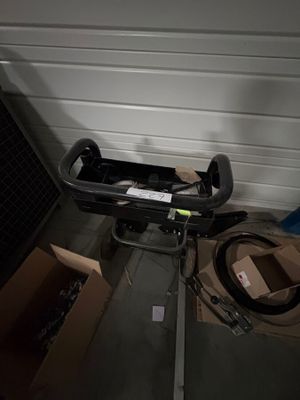 a box with a handlebar attached to it and a box with a handlebar attached to it in front of a garage door