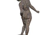 statue of a man holding a tennis racquet on a white surface